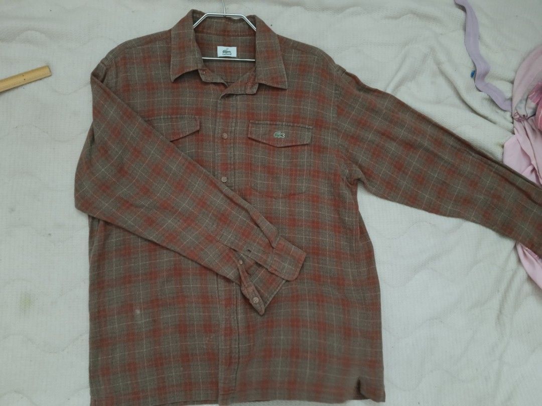 Lacoste Plaid Long Sleeve Shirt (Category: Tshirts & Polo Shirts ) located in Valenzuela. Submitted by relchris22 (Listing ID 1456150560, Image 1). Description: - Classic Lacoste plaid long-sleeved shirt - Two chest pockets with button closure - Iconic Lacoste crocodile logo - Small fabric mark (visible in last photo) - Perfect for casual outfits.