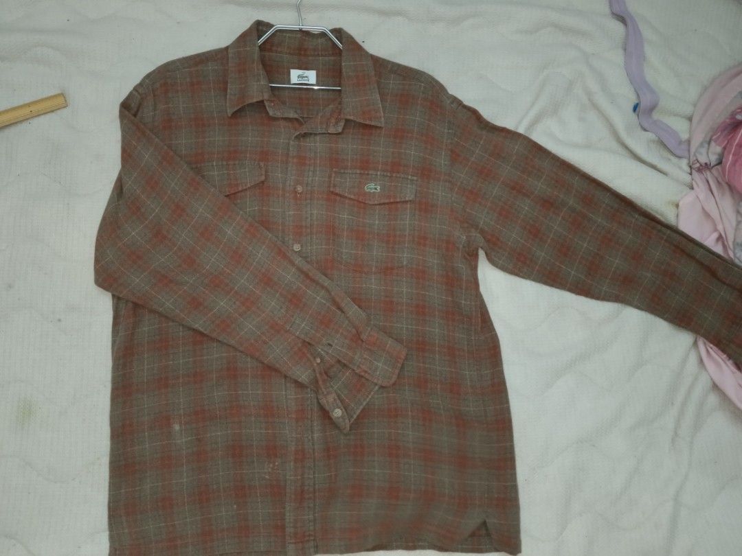 Lacoste Plaid Long Sleeve Shirt (Category: Tshirts & Polo Shirts ) located in Valenzuela. Submitted by relchris22 (Listing ID 1456150560, Image 2). Description: - Classic Lacoste plaid long-sleeved shirt - Two chest pockets with button closure - Iconic Lacoste crocodile logo - Small fabric mark (visible in last photo) - Perfect for casual outfits.