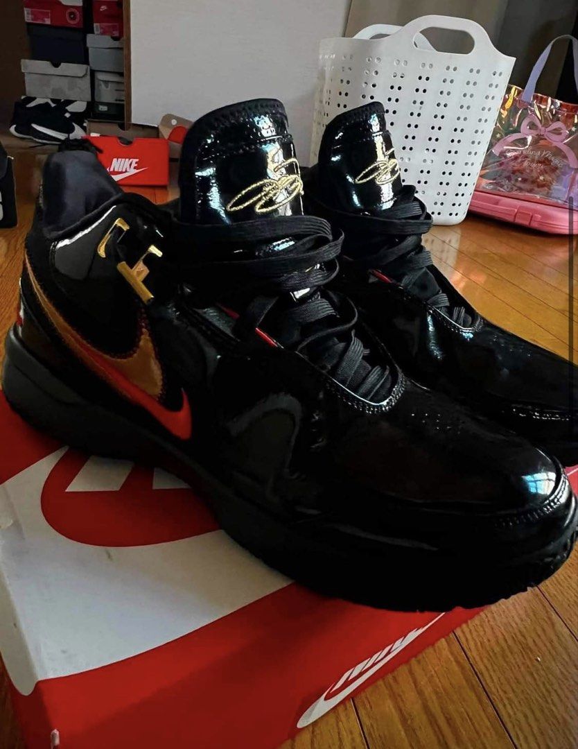 Lebron NXXT Gen Ampd ep Basketball (Category: Sneakers) located in Manila. Submitted by gentle.earth (Listing ID 1456055571, Image 2). Description: - Black patent leather Nike LeBron NXXT GEN AMPD EP - Gold and red accents on swoosh and heel - High-top design with secure straps - Comes with original box - Ideal for basketball performance or stylish casual wear - Eye-catching design.