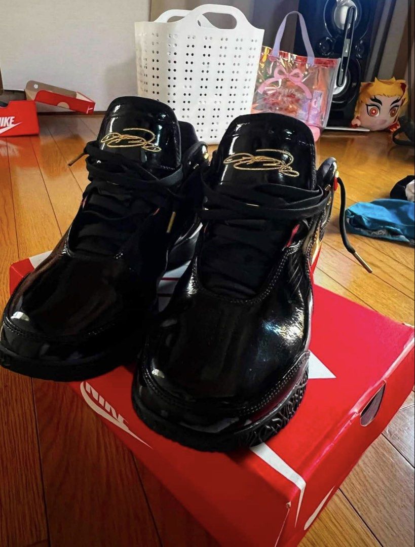 Lebron NXXT Gen Ampd ep Basketball (Category: Sneakers) located in Manila. Submitted by gentle.earth (Listing ID 1456055571, Image 1). Description: - Black patent leather Nike LeBron NXXT GEN AMPD EP - Gold and red accents on swoosh and heel - High-top design with secure straps - Comes with original box - Ideal for basketball performance or stylish casual wear - Eye-catching design.