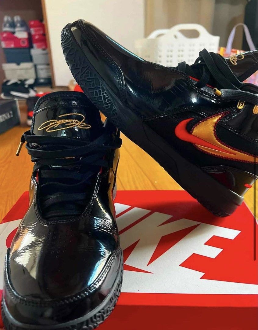 Lebron NXXT Gen Ampd ep Basketball (Category: Sneakers) located in Manila. Submitted by gentle.earth (Listing ID 1456055571, Image 3). Description: - Black patent leather Nike LeBron NXXT GEN AMPD EP - Gold and red accents on swoosh and heel - High-top design with secure straps - Comes with original box - Ideal for basketball performance or stylish casual wear - Eye-catching design.