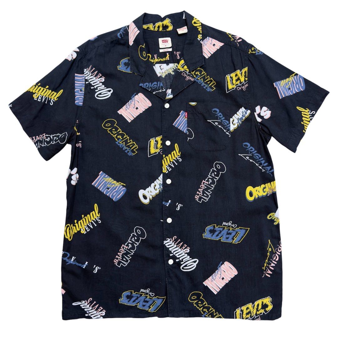 Levis Graphic Print Short Sleeve Shirt (Category: Tshirts & Polo Shirts ) located in Dinalupihan. Submitted by brokencasket (Listing ID 1456205002, Image 1). Description: Levis Graphic Print Short Sleeve Shirt Size M on tag. Measurements on photo. Color may vary due to lighting..