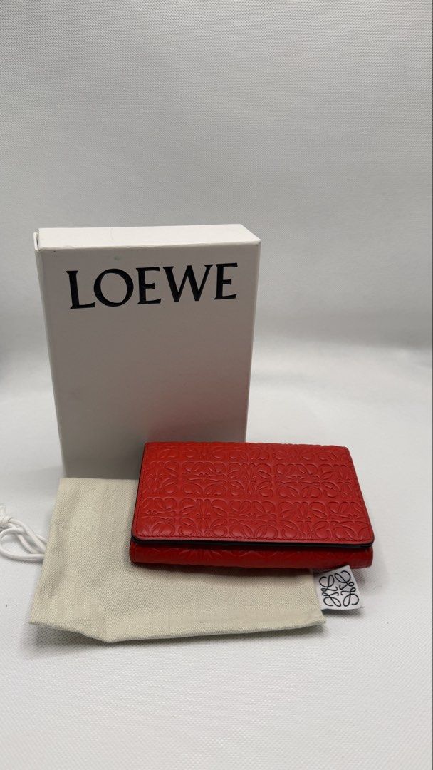 LOEWE Anagram Embossed Leather Wallet Red (Category: Luxury Bags & Wallets) located in Pasig City. Submitted by shoptilyoudrop87 (Listing ID 1456166324, Image 1). Description: - Authentic red LOEWE wallet - Features the iconic Anagram pattern - Made from premium leather - Includes a secure zip pocket - Comes with original box and dust bag - Ideal for organizing cards and cash Guaranteed authentic. Legit check all you want. Slightly negotiable, lo
