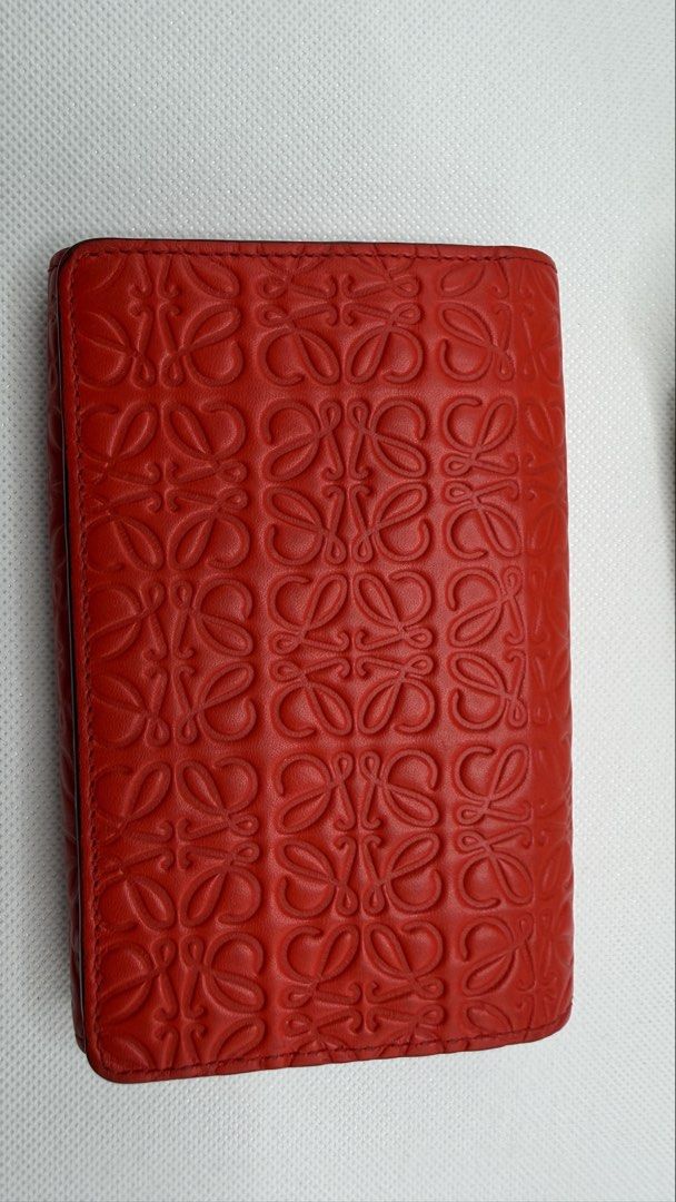 LOEWE Anagram Embossed Leather Wallet Red (Category: Luxury Bags & Wallets) located in Pasig City. Submitted by shoptilyoudrop87 (Listing ID 1456166324, Image 2). Description: - Authentic red LOEWE wallet - Features the iconic Anagram pattern - Made from premium leather - Includes a secure zip pocket - Comes with original box and dust bag - Ideal for organizing cards and cash Guaranteed authentic. Legit check all you want. Slightly negotiable, lo