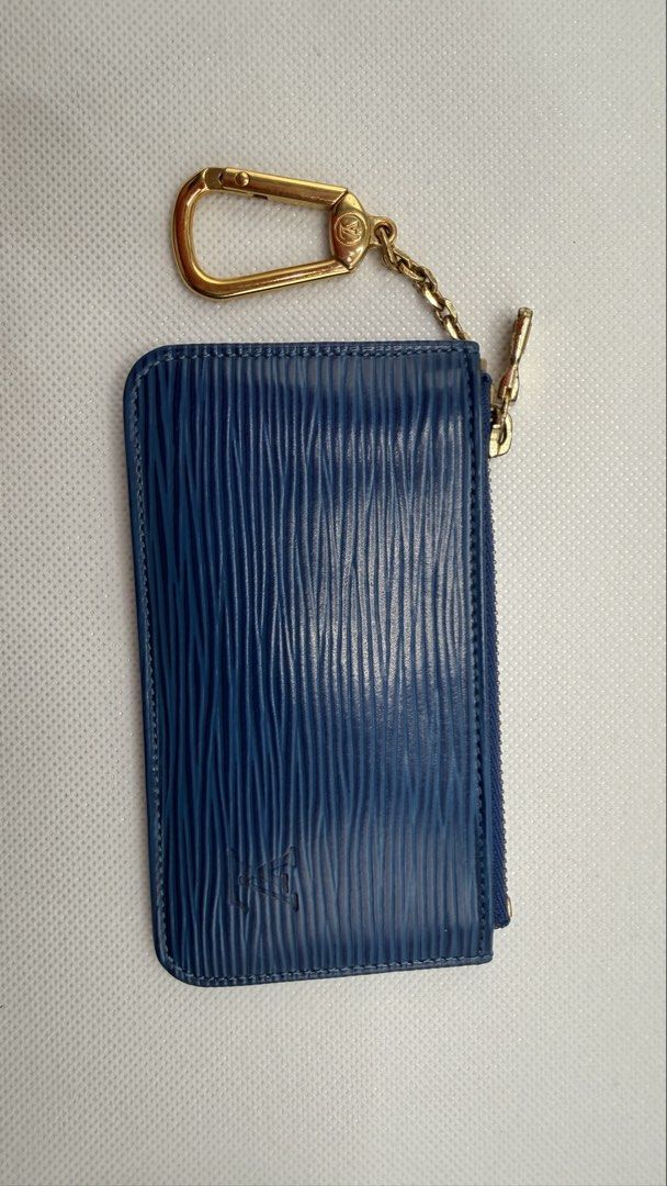 Louis Vuitton Blue Epi Leather Key Cles (Category: Luxury Bags & Wallets) located in Pasig City. Submitted by shoptilyoudrop87 (Listing ID 1456176792, Image 2). Description: - Authentic Louis Vuitton Key Cles - Made with luxurious Epi leather - Deep blue color - Comes with original Louis Vuitton box and dust bag - Features a stylish gold-tone zipper - Includes a key ring with clasp - Interior stamped 'Louis Vuitton Paris made in France - Ideal fo