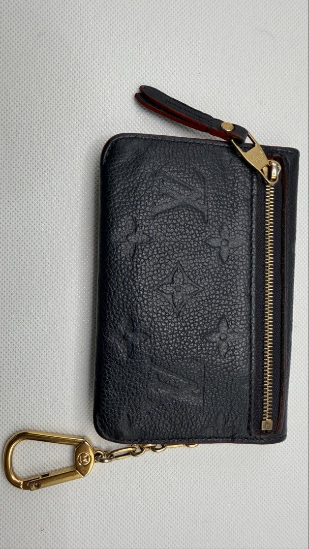 Louis Vuitton Empreinte Key Cles Pouch (Category: Luxury Bags & Wallets) located in Pasig City. Submitted by shoptilyoudrop87 (Listing ID 1456175337, Image 3). Description: - Authentic Louis Vuitton Key Cles - Empreinte leather - Dark Blue leather with red trim - Includes original box, dust bag - Made in France - Normal signs of use with removed initials Guaranteed authentic. Legit check all you want. Slightly negotiable, low ballers will be igno