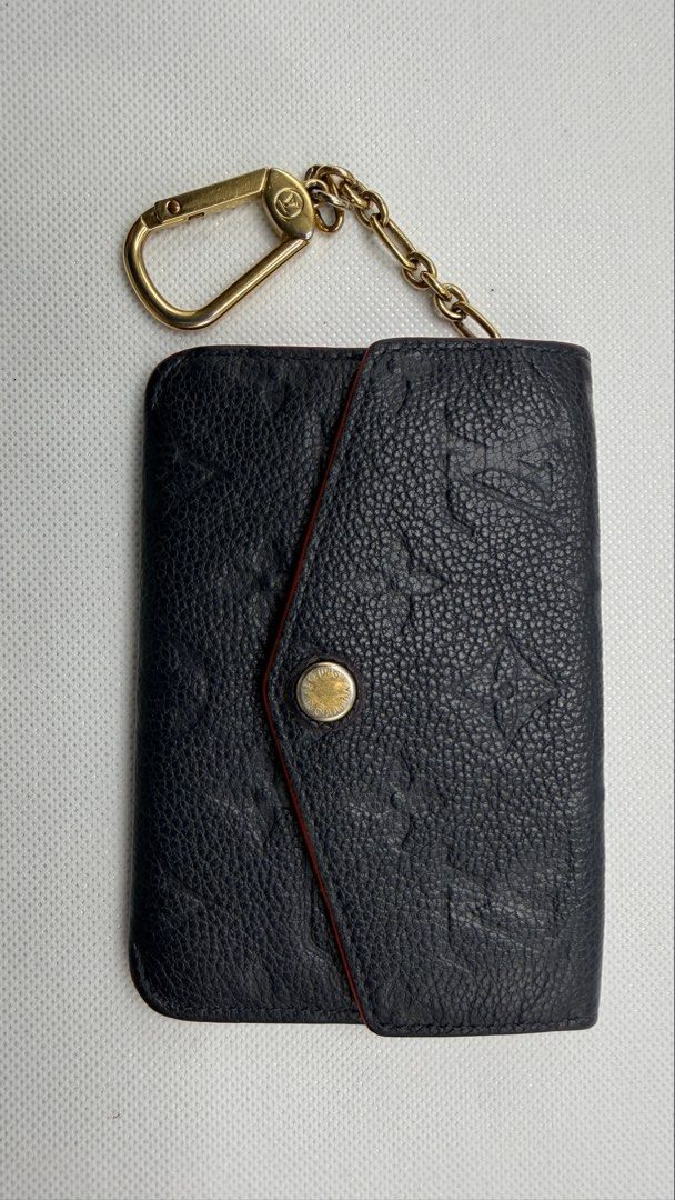 Louis Vuitton Empreinte Key Cles Pouch (Category: Luxury Bags & Wallets) located in Pasig City. Submitted by shoptilyoudrop87 (Listing ID 1456175337, Image 2). Description: - Authentic Louis Vuitton Key Cles - Empreinte leather - Dark Blue leather with red trim - Includes original box, dust bag - Made in France - Normal signs of use with removed initials Guaranteed authentic. Legit check all you want. Slightly negotiable, low ballers will be igno