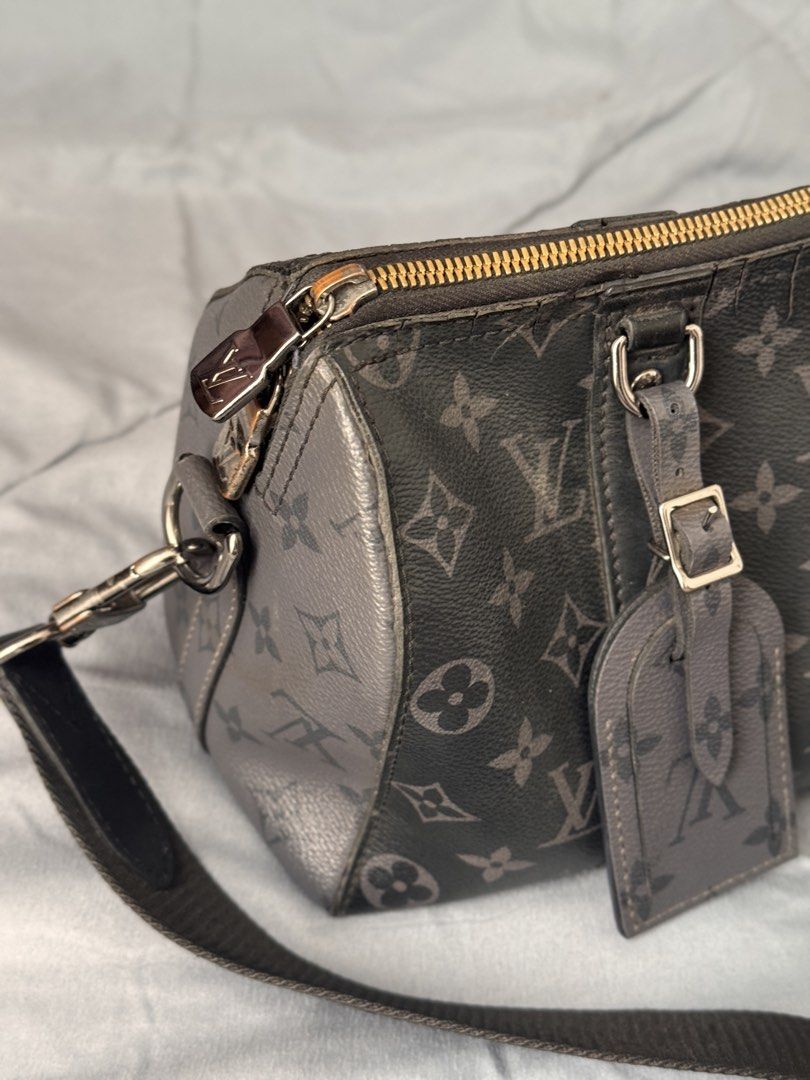 Louis Vuitton Monogram Canvas City Keepall Bag (Category: Luxury Bags & Wallets) located in Bacolod City. Submitted by luxejones (Listing ID 1456058144, Image 2). Description: - Louis Vuitton Keepall Bandouliere - Dark grey monogram canvas - Zipper closure - Adjustable shoulder strap included - Some wear on zipper trim and piping - Please check photos for detailed condition - with box and dustbag.