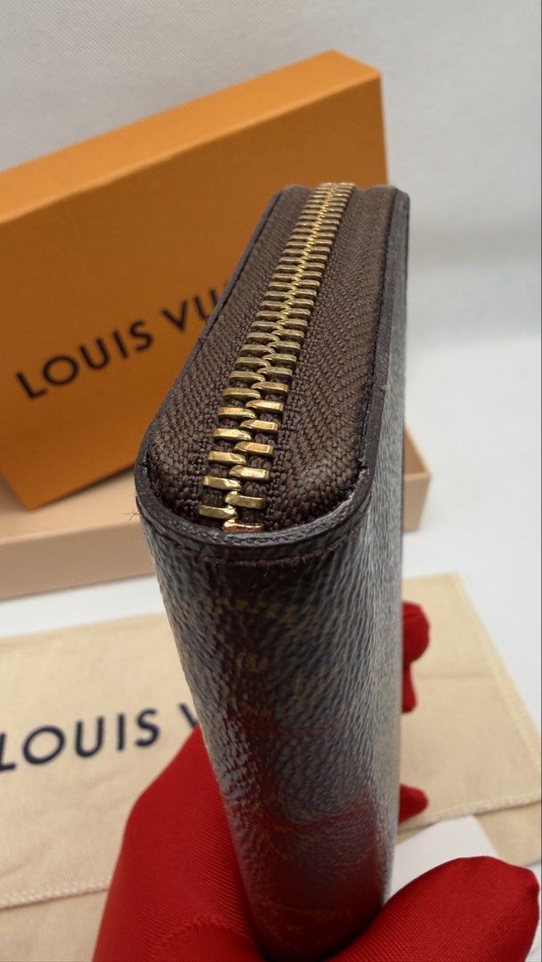 Louis Vuitton Monogram Clemence wallet (Category: Luxury Bags & Wallets) located in Pasig City. Submitted by shoptilyoudrop87 (Listing ID 1456176358, Image 2). Description: - Authentic Louis Vuitton monogram wallet -Unique pink interior card slots - Zip-around closure for security - Includes original box and dust bag - Adorable flower charm attached to the zipper - Ideal for organizing cards and cash -Normal signs of use Guaranteed authentic. Leg