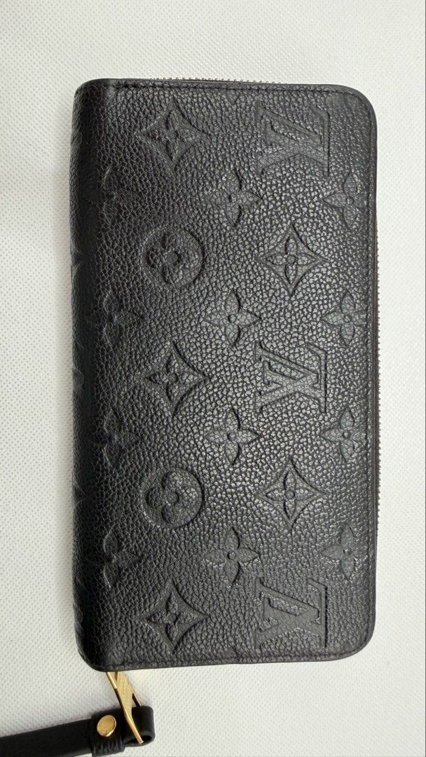 Louis Vuitton Monogram Empreinte Zipped Wallet (Category: Luxury Bags & Wallets) located in Pasig City. Submitted by shoptilyoudrop87 (Listing ID 1456175876, Image 3). Description: - Authentic Louis Vuitton Zipped Wallet - Material: Black Monogram Empreinte Leather - Includes Original Box and Dust Bag - Features Gold Hardware Details - Ample Card Slots and Compartments - Ideal for Everyday Use or Travel -Microchipped, smells and feels brand new G