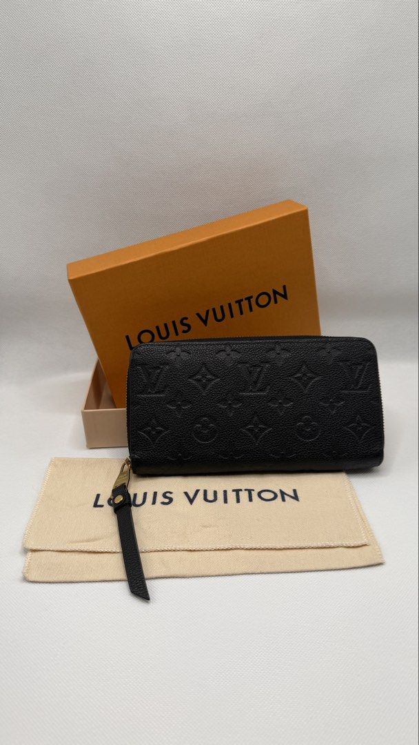Louis Vuitton Monogram Empreinte Zipped Wallet (Category: Luxury Bags & Wallets) located in Pasig City. Submitted by shoptilyoudrop87 (Listing ID 1456175876, Image 1). Description: - Authentic Louis Vuitton Zipped Wallet - Material: Black Monogram Empreinte Leather - Includes Original Box and Dust Bag - Features Gold Hardware Details - Ample Card Slots and Compartments - Ideal for Everyday Use or Travel -Microchipped, smells and feels brand new G