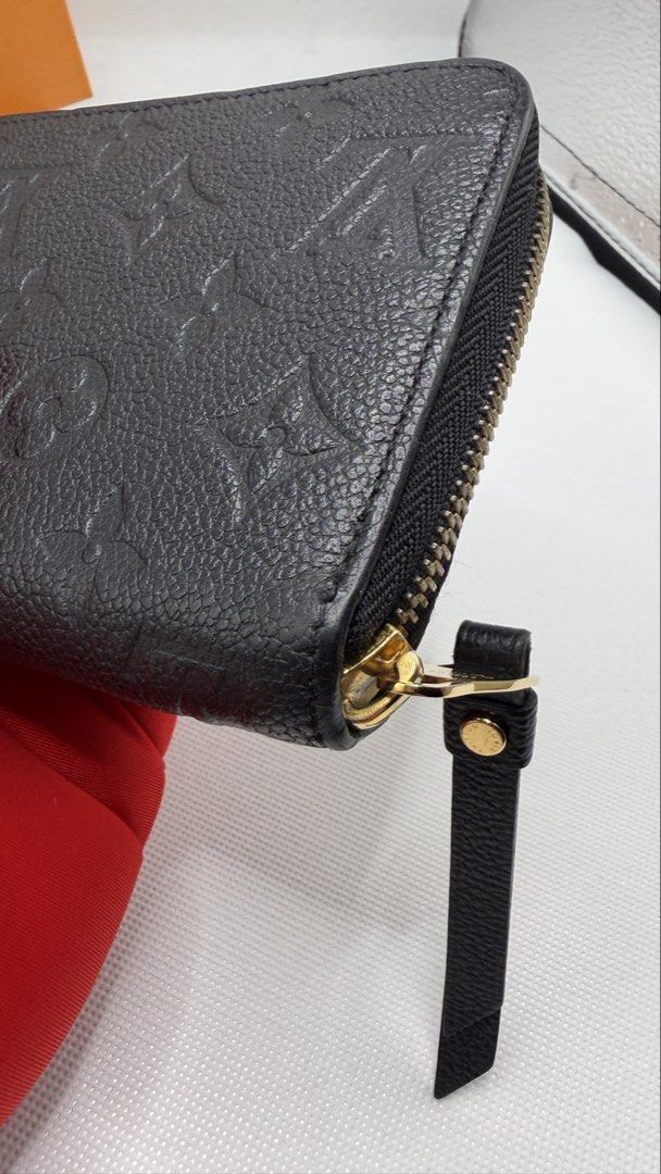 Louis Vuitton Monogram Empreinte Zipped Wallet (Category: Luxury Bags & Wallets) located in Pasig City. Submitted by shoptilyoudrop87 (Listing ID 1456175876, Image 2). Description: - Authentic Louis Vuitton Zipped Wallet - Material: Black Monogram Empreinte Leather - Includes Original Box and Dust Bag - Features Gold Hardware Details - Ample Card Slots and Compartments - Ideal for Everyday Use or Travel -Microchipped, smells and feels brand new G