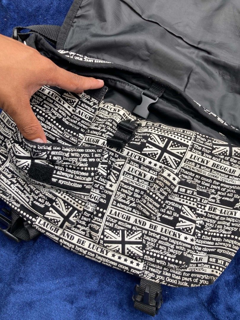 Love Rock Messenger Bag (Category: Sling Bags) located in Naga. Submitted by grunchieeeerr (Listing ID 1456108966, Image 3). Description: Cool Union Jack messenger bag with 'Love Rock' design. Features buckle and zip closures, adjustable strap. Perfect for daily use or concerts. 10x15.