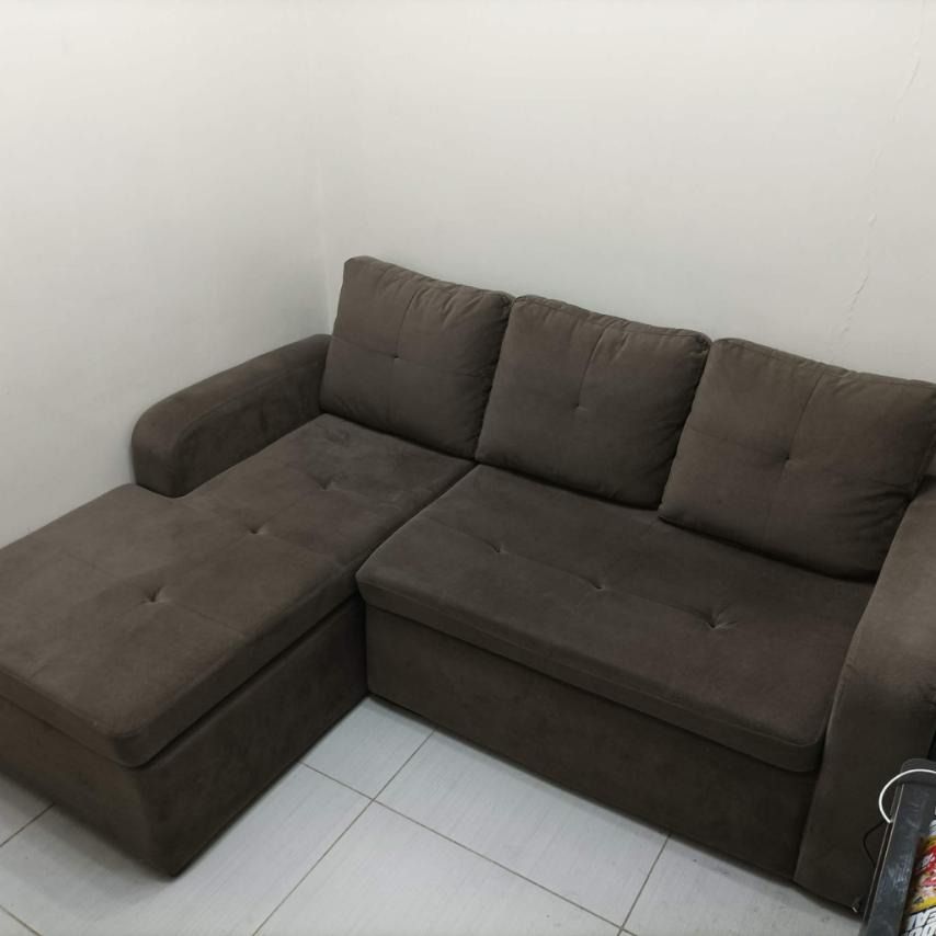 L-Shaped Sofa (Category: Sofas) located in Mandaluyong City. Submitted by crimsonblake (Listing ID 1456184726, Image 2). Description: - Dark grey L-shaped sofa - Comfortable seating for multiple people - Ideal for living rooms or apartments - Original Price is 25k -RFS: decluttering - Buyer will pickup item .
