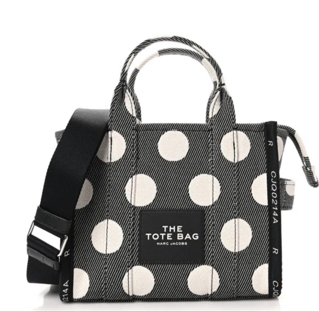 Marc Jacobs The Tote Bag canvasPolka Dot (Category: Luxury Bags & Wallets) located in Manila. Submitted by dominique_737 (Listing ID 1456155262, Image 1). Description: Authentic Marc Jacobs The Tote Bag in a fun polka dot canvas. Has top handles and a detachable crossbody strap. Zipper closure keeps your belongings secure. Great size for everyday use. Comes with original tags attached..