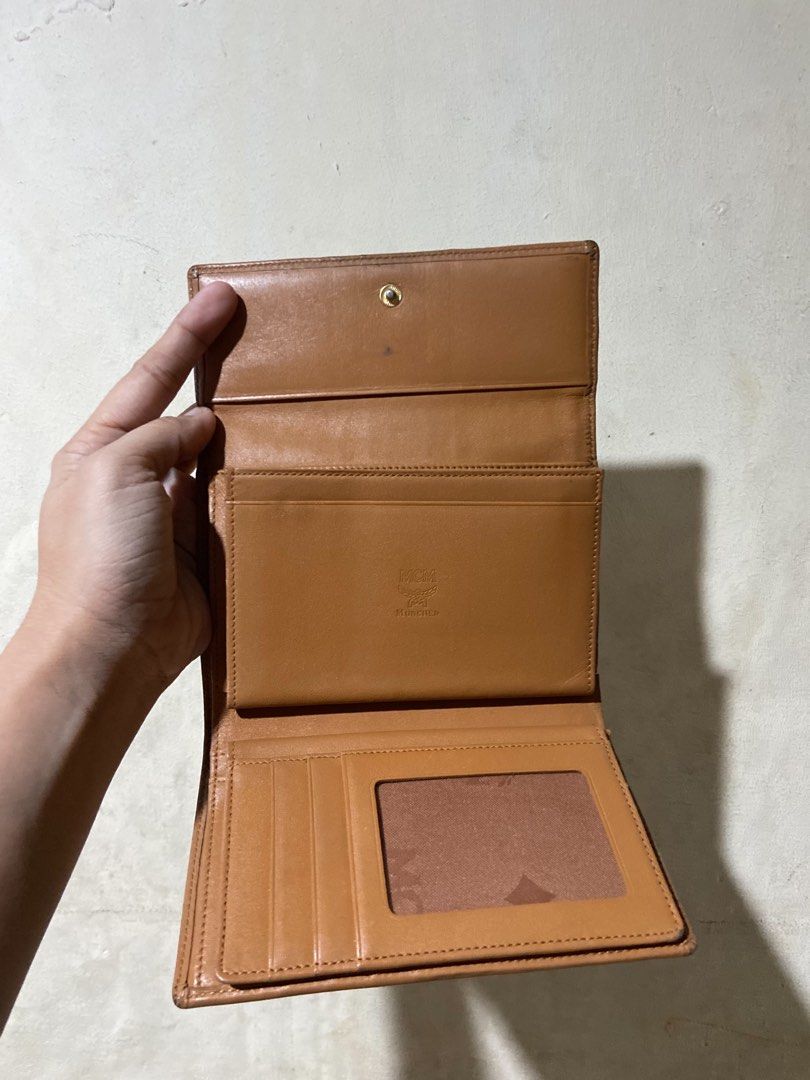 MCM Visetos Trifold Wallet Cognac (Category: Luxury Bags & Wallets) located in Manila. Submitted by starbalesukandjapansurplus (Listing ID 1456084461, Image 3). Description: - Authentic MCM wallet - Classic Visetos print - Trifold design - Multiple card slots - Clear ID window - Interior is clean - Stylish and practical for everyday use.