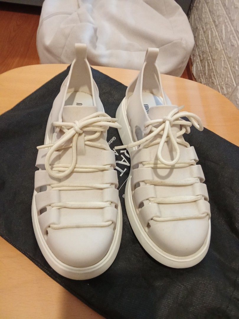 Melissa White Jelly Lace-Up Platform Sandals (Category: Flats & Sandals) located in Las Pinas. Submitted by Gienuine (Listing ID 1456125251, Image 2). Description: - White Melissa jelly sandals - Lace-up front - Platform sole for added height - Super comfy for casual wear - Easy-to-clean material - Perfect for summer days - NO BOX.