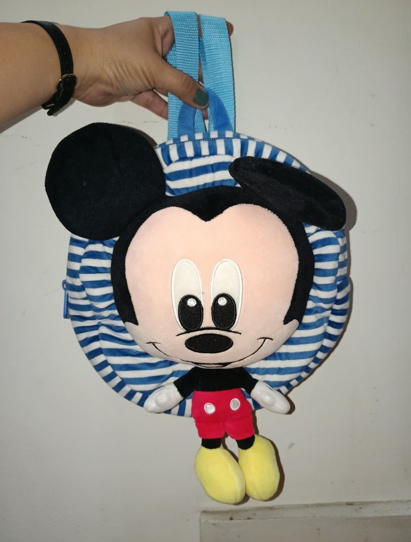 Mickey Mouse Plush Backpack Blue White Stripes (Category: Backpacks) located in Bacolod City. Submitted by bhebisexy08 (Listing ID 1456232790, Image 1). Description: - Adorable Mickey Mouse plush backpack - Features a cute blue and white striped design - Soft and plush Mickey Mouse face - Mickey's classic outfit: black shirt, red shorts, yellow shoes - Light blue adjustable straps - Ideal for kids or any Disney enthusiast.