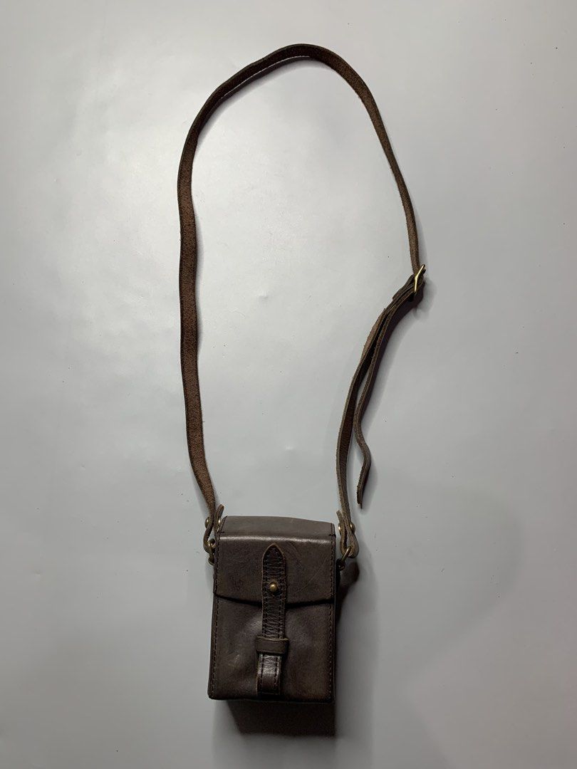 Mihara Yasuhiro x Canon Sling Bag (Category: Sling Bags) located in Binan City. Submitted by hybrid_archival_theory (Listing ID 1456186418, Image 1). Description: Mihara Yasuhiro Leather Camera Bag Collaboration With Canon Rare Piece Limited edition USED Measurements- Height- 9 cm Width- 8 cm No Inclusions Bag only Please Check Detailed Photos Posted For Your Reference Thankyou! •is a Miharayasuhiro Leather Camera Bag, specifically created as a r