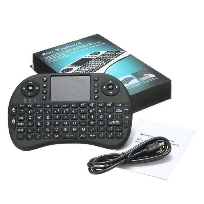 Mini i8 Wireless Touchpad Keyboard with USB Dongle (Category: Computer Keyboard) located in Manila. Submitted by marvieobordo (Listing ID 1456216824, Image 1). Description: - Mini wireless keyboard with integrated touchpad - Universal compatibility: Laptops, desktops, Smart TVs, Android boxes, and more - Includes USB dongle and charging cable - Ideal for presentations and remote media control - Compact and easy to use design.