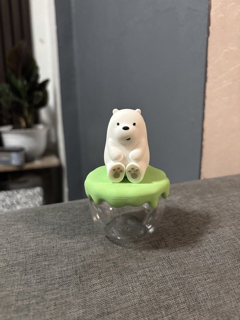 Miniso We Bare Bears Ice Bear Storage Jar Blind Box (Category: Food Organization & Storage) located in Naga. Submitted by myroomarchive (Listing ID 1456191423, Image 1). Description: - Adorable Miniso storage jar featuring Ice Bear from We Bare Bears. - Includes original box and card. - Ideal for storing small trinkets or displaying as a collectible. - Clear jar with a vibrant green lid. - Features a charming Ice Bear figure on top. - A must-have