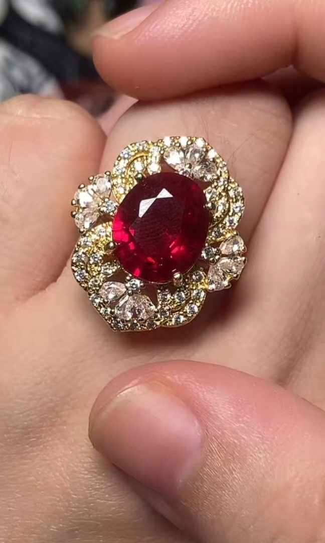 Mozambique Ruby Ring (Category: Rings) located in Kota Kinabalu. Submitted by cahayabulan123 (Listing ID 1456185996, Image 3). Description: Stunning Design: Features a vibrant red lab-created ruby center stone with an elegant halo setting. ​Specifications: Total weight of 6.70g with certified laboratory authenticity. ​Great Value: A bold, statement-making piece offering a luxurious look at an affordable price. ​Quality Materials: Set on a durable