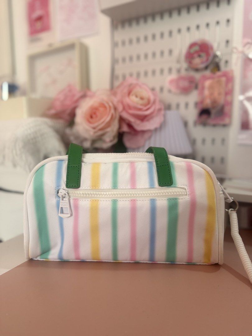 Mumu Select Striped Bag with Green Straps (Category: Luxury Bags & Wallets) located in Cavite. Submitted by j.nellie.r_ (Listing ID 1456229420, Image 2). Description: - Cute Mumu Select cosmetic bag - Pastel stripes: pink, yellow, green, blue - White canvas material - Two front zippered pockets - Main zippered compartment - Green top straps - Ideal for organizing makeup and toiletries.