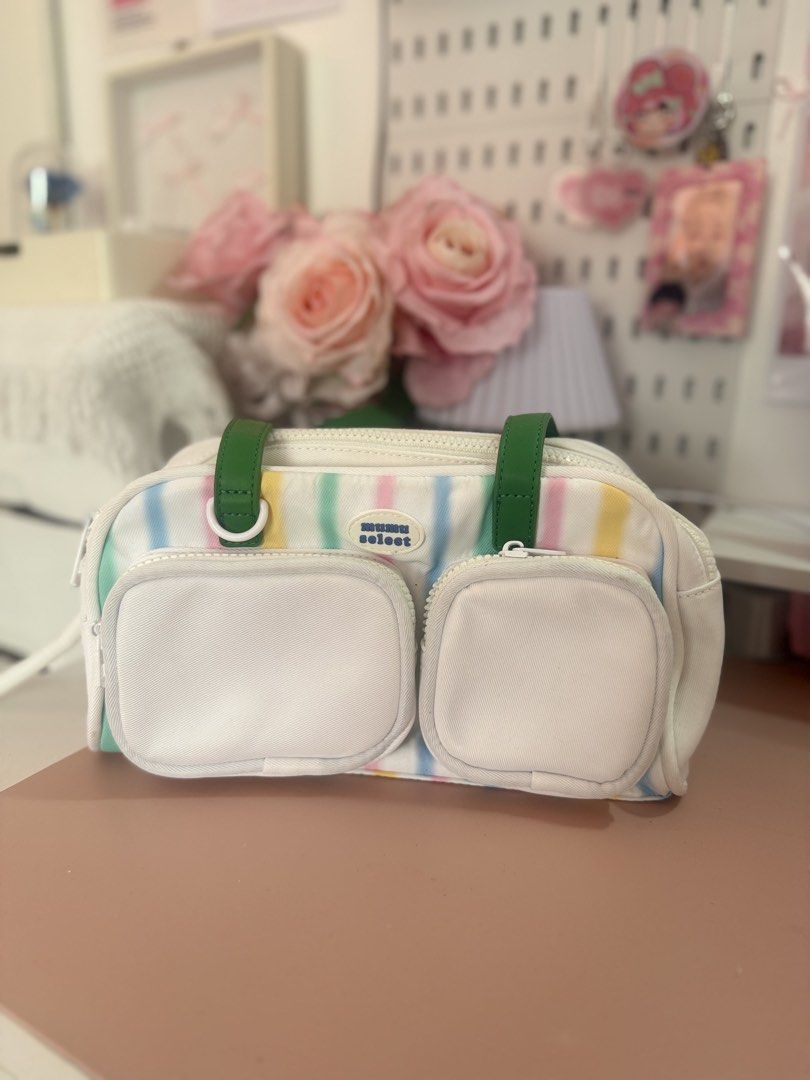 Mumu Select Striped Bag with Green Straps (Category: Luxury Bags & Wallets) located in Cavite. Submitted by j.nellie.r_ (Listing ID 1456229420, Image 1). Description: - Cute Mumu Select cosmetic bag - Pastel stripes: pink, yellow, green, blue - White canvas material - Two front zippered pockets - Main zippered compartment - Green top straps - Ideal for organizing makeup and toiletries.