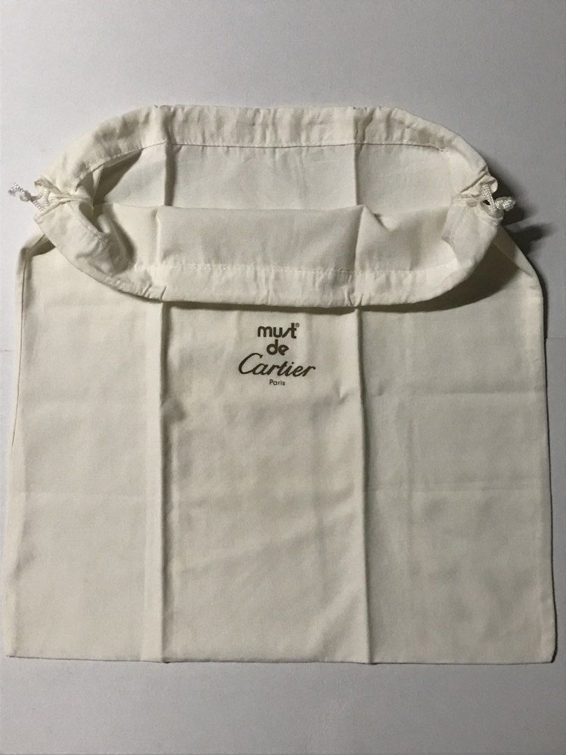 Must de Cartier Paris Dustbag (Category: Luxury Bags & Wallets) located in Manila. Submitted by iyasellsph (Listing ID 1456132498, Image 2). Description: Must de Cartier dustbag See size on photo Off-white cotton material Drawstring With 1 small brown storage mark Vintage in very good condition overall.
