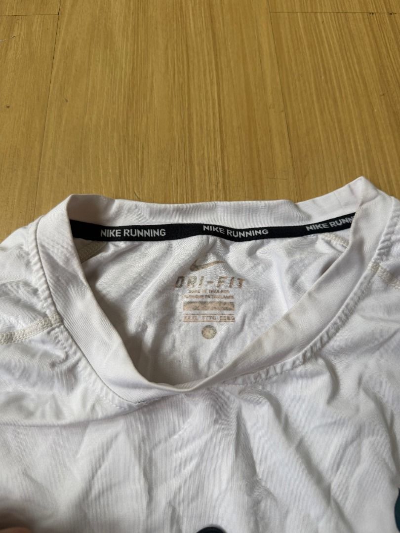 NIKE | Dri-FIT Compression longsleeves t-shirt (Category: Activewear) located in Pasig City. Submitted by franco.mendoza (Listing ID 1456123741, Image 2). Description: White Nike Dri-FIT running shirt. Lightweight, breathable, with classic swoosh. Perfect for runs and training. - issues: tag fading - 22 x 29 - size XXXL .