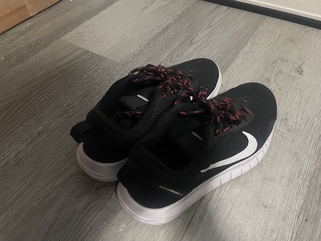 Nike Flex Experience 12 Black White Red Running Shoes (Category: Sneakers) located in Dumaguete. Submitted by han_heuinanta (Listing ID 1456198616, Image 2). Description: **IMPORTANT** Actual size is EUR 38.5, US 7.5, UK 5 Carousel doesn’t have that option - Nike Flex Experience 12 running shoes - Color: Black with white accents - Laces: Red and black speckled design - Lightweight and comfortable for running or casual wear - Features the iconic N