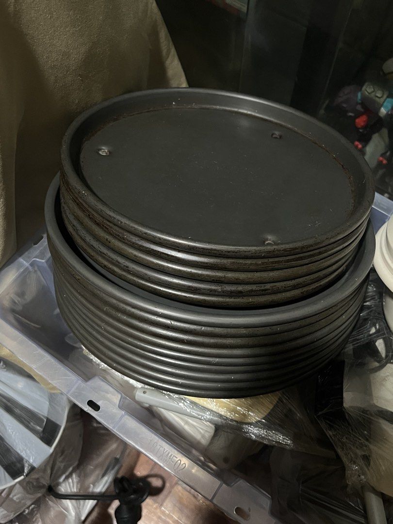 Nonstick Stackable Pizza Pans 10” and 9” (Heavy Duty) (Category: Other Kitchenware & Tableware) located in Quezon City. Submitted by chloe_declutter (Listing ID 1456064873, Image 1). Description: 9”- 5pcs 10”- 7pcs Heavy duty thick Stackable.
