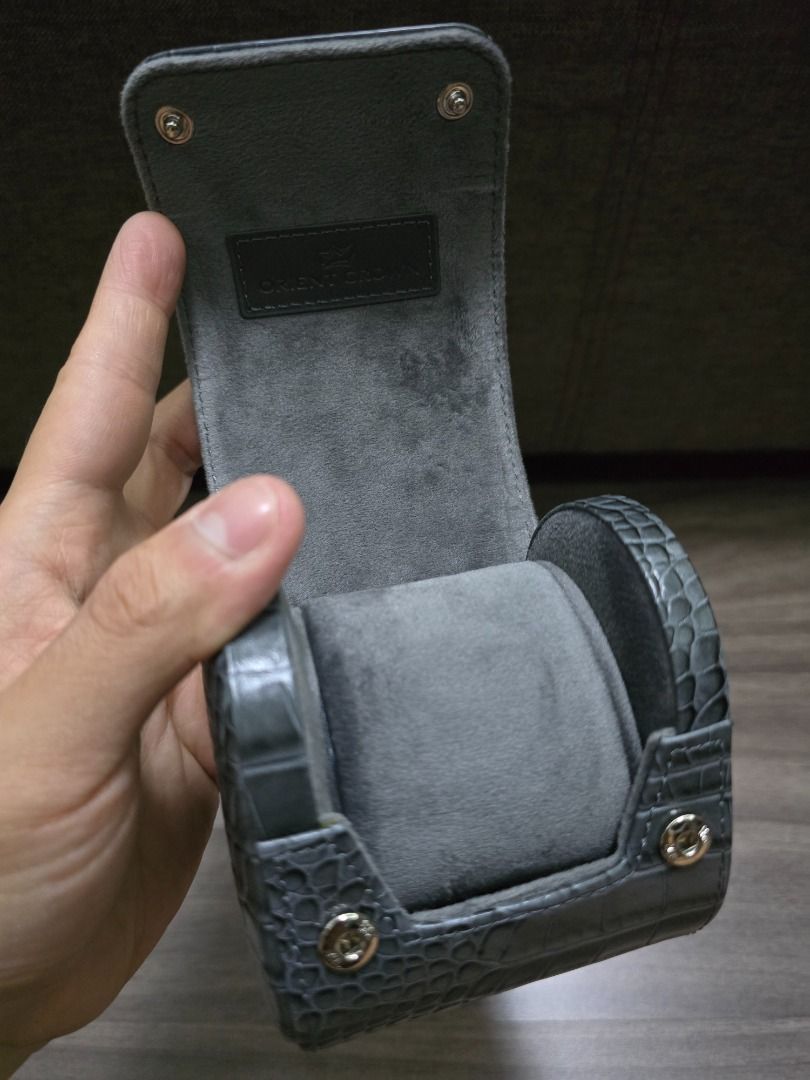 Orient Crown Watch Travel Case Holder (Category: Men's Watches) located in Manila. Submitted by ddc77 (Listing ID 1456193873, Image 2). Description: - Grey faux crocodile leather watch case - Fits one watch - Soft interior lining for protection - Secure snap closure - Comes with original Orient Crown box - Ideal for travel or safe storage Bought 11k Used only for storage in private vault.