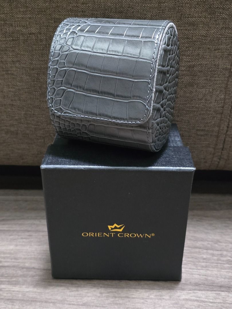 Orient Crown Watch Travel Case Holder (Category: Men's Watches) located in Manila. Submitted by ddc77 (Listing ID 1456193873, Image 1). Description: - Grey faux crocodile leather watch case - Fits one watch - Soft interior lining for protection - Secure snap closure - Comes with original Orient Crown box - Ideal for travel or safe storage Bought 11k Used only for storage in private vault.