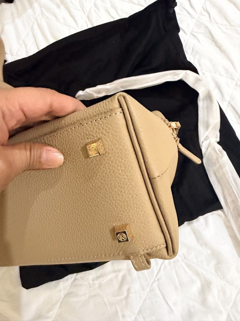 Par Leather: Dani Bag (Category: Cross-body Bags) located in Cagayan de Oro. Submitted by teeea89 (Listing ID 1456066938, Image 3). Description: Impulsive buyer here. Used only for less than a month - Beige leather crossbody bag - Gold hardware details (zippers, strap buckle) - Pebbled leather texture - Adjustable strap for comfort - Comes with a dust bag - Ideal for everyday use.