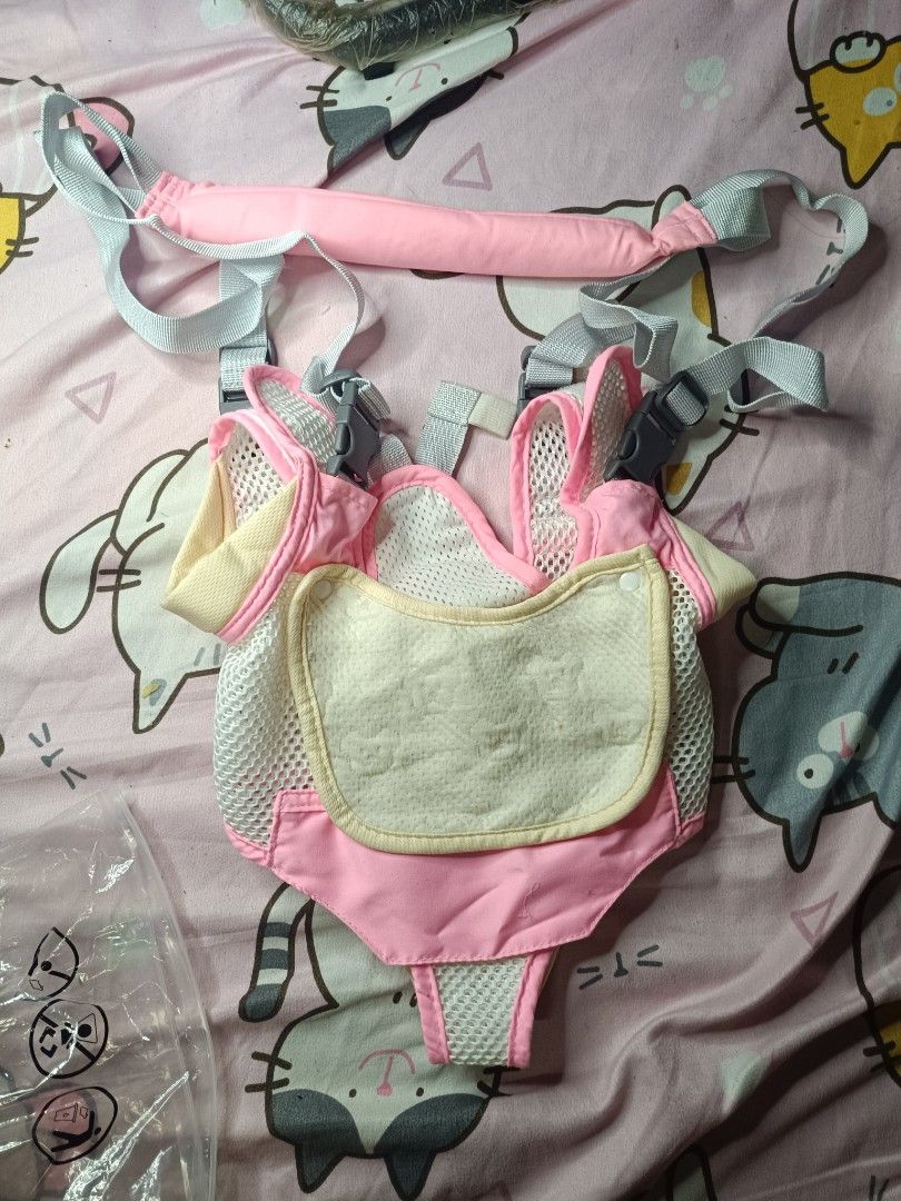 Pink Baby harness with Mesh Panels (Category: Carriers & Slings) located in Mandaluyong City. Submitted by arabellascraftandcharms (Listing ID 1456061704, Image 1). Description: - Pink baby carrier with a light yellow bib - Features mesh panels for excellent breathability - Adjustable straps ensure a comfortable and secure fit - Designed for easy on and off - Perfect for parents who are always on the move.
