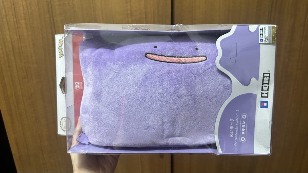 Pokemon Ditto Hori Pouch for Nintendo Switch (Category: Nintendo) located in Manila. Submitted by issamatibag (Listing ID 1456189012, Image 1). Description: - Super cute Ditto pouch for your Nintendo Switch OLED - Can store your console and accessories - Comes with a shoulder strap - Great for Pokemon fans!.