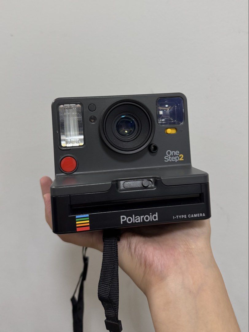 Polaroid OneStep2 Viewfinder i-Type Camera (Graphite Gray) (Category: Cameras) located in Manila. Submitted by pousey (Listing ID 1455681294, Image 1). Description: Condition: Barely used, in excellent condition, no signs of wear Issue/s: None Inclusions: Camera unit, charger, neck strap, user manual, original box/packaging RFS: Decluttering OG Price: ₱9,000 P.S: Bring own film for testing (optional) Loc: Quezon City, Metro Manila Shipping: Meetu