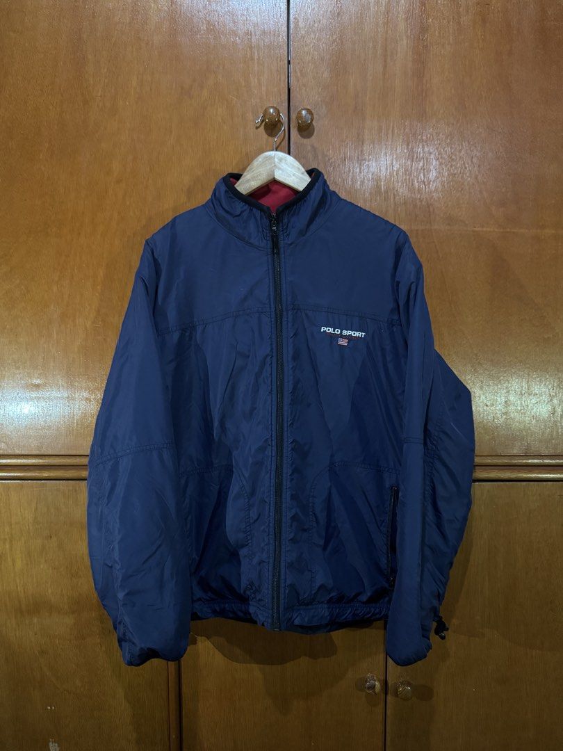 Polo Sport Reversible Full-Zip Jacket (Category: Coats, Jackets and Outerwear) located in Cebu City. Submitted by ActiveLounge (Listing ID 1456176743, Image 2). Description: Polo Sport Reversible Full-Zip Jacket Brand: Polo Sport Ralph Lauren Style: Full-zip lightweight jacket with stand collar Color: Navy Blue Size: Large Details: Features embroidered Polo Sport chest logo, full front zipper, stand collar, and adjustable cuffs. Condition: Pre-ow