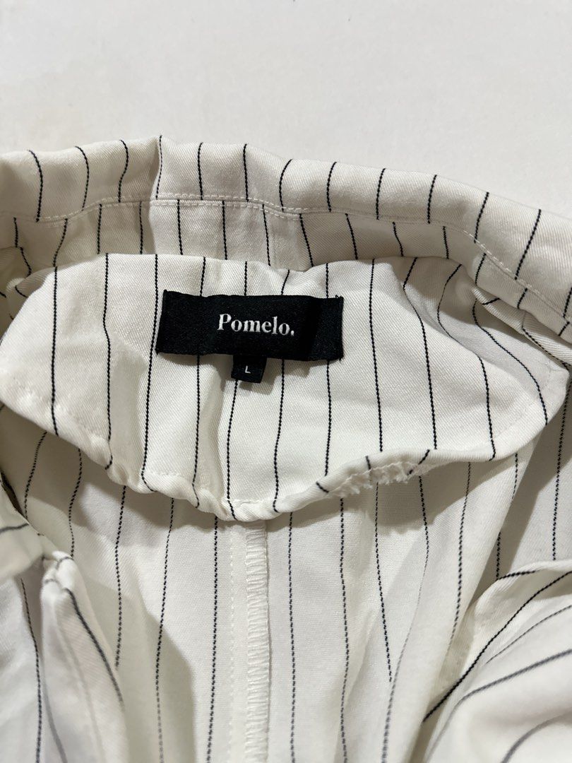 Pomelo Striped Blazer Size L (Category: Coats, Jackets and Outerwear) located in Quezon City. Submitted by aleezy (Listing ID 1456098341, Image 2). Description: - White blazer with black pinstripes - Brand: Pomelo - Size: L - Material: Lightweight, ideal for layering - Design: Buttonless front - Sleeves: Full length - Style: Great for smart casual outfits.
