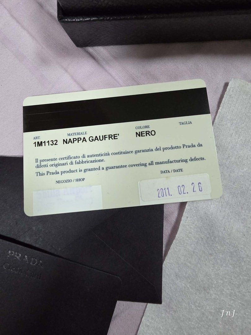Prada Nappa Gaufre Wallet Black (Category: Luxury Bags & Wallets) located in Pasig City. Submitted by cecilececile4361 (Listing ID 1456154234, Image 2). Description: - Authentic Prada Wallet - Material: Black Nappa Gaufre - Includes Original Box - Includes Authenticity Card - Purchase Year: 2011 - Multiple Card Slots - Numerous Compartments - Perfect for organizing essentials.