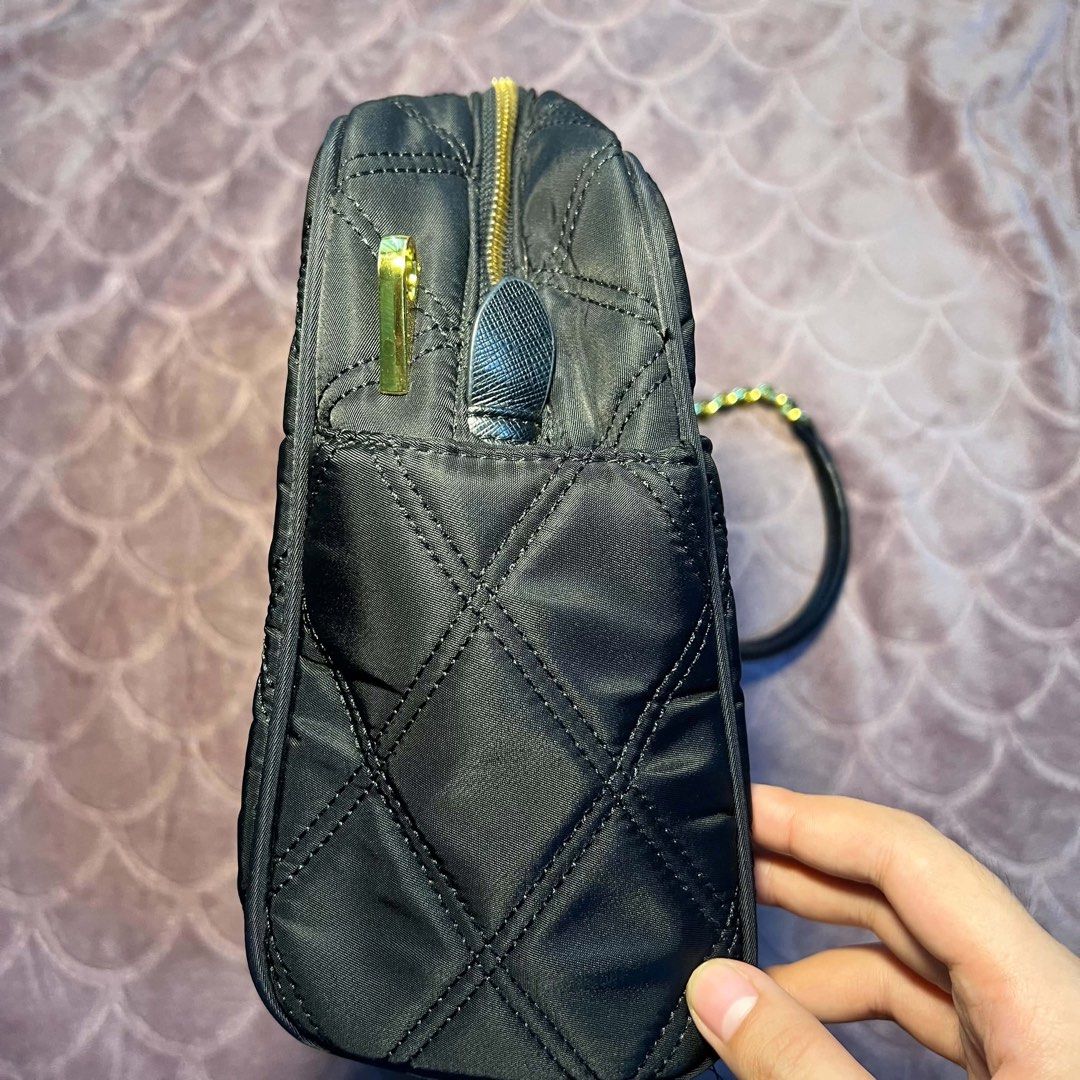 Prada Quilted Nylon Chain Shoulder Bag Black Gold (Category: Luxury Bags & Wallets) located in Batangas. Submitted by bettyboop0703 (Listing ID 1456087323, Image 3). Description: - Authentic Black Prada Bag - Quilted Nylon Material - Gold Chain Straps and Hardware - Interior Zip Pocket and Multiple Compartments - Small Leather Tag Detail - Versatile for Everyday or Evening Wear.