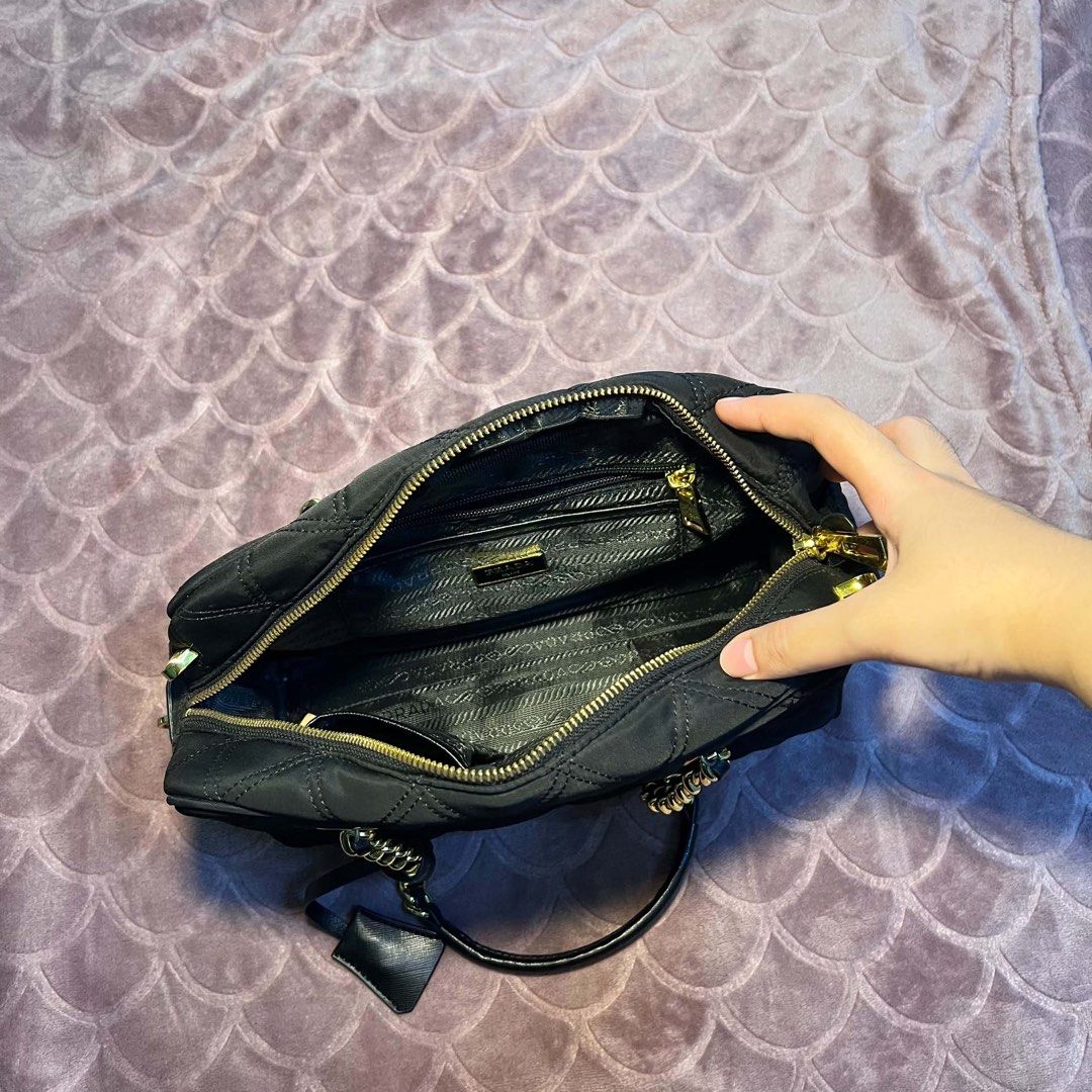 Prada Quilted Nylon Chain Shoulder Bag Black Gold (Category: Luxury Bags & Wallets) located in Batangas. Submitted by bettyboop0703 (Listing ID 1456087323, Image 2). Description: - Authentic Black Prada Bag - Quilted Nylon Material - Gold Chain Straps and Hardware - Interior Zip Pocket and Multiple Compartments - Small Leather Tag Detail - Versatile for Everyday or Evening Wear.