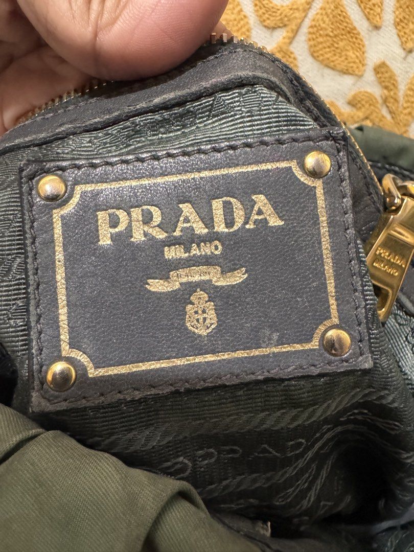 Authentic Prada Tessuto Gaufre Ruched Shoulder Bag (Category: Luxury Bags & Wallets) located in San Pablo. Submitted by docannie3869170 (Listing ID 1456068671, Image 3). Description: - Authentic Prada Bag My personal collection. - Color: Green Nylon with Grey Leather Trim - Features: Ruched Detailing, Gold Hardware, Detachable Shoulder Strap - Origin: Made in Italy - Interior: Zip Pocket - Condition: Good, with some signs of wear on leather trim 