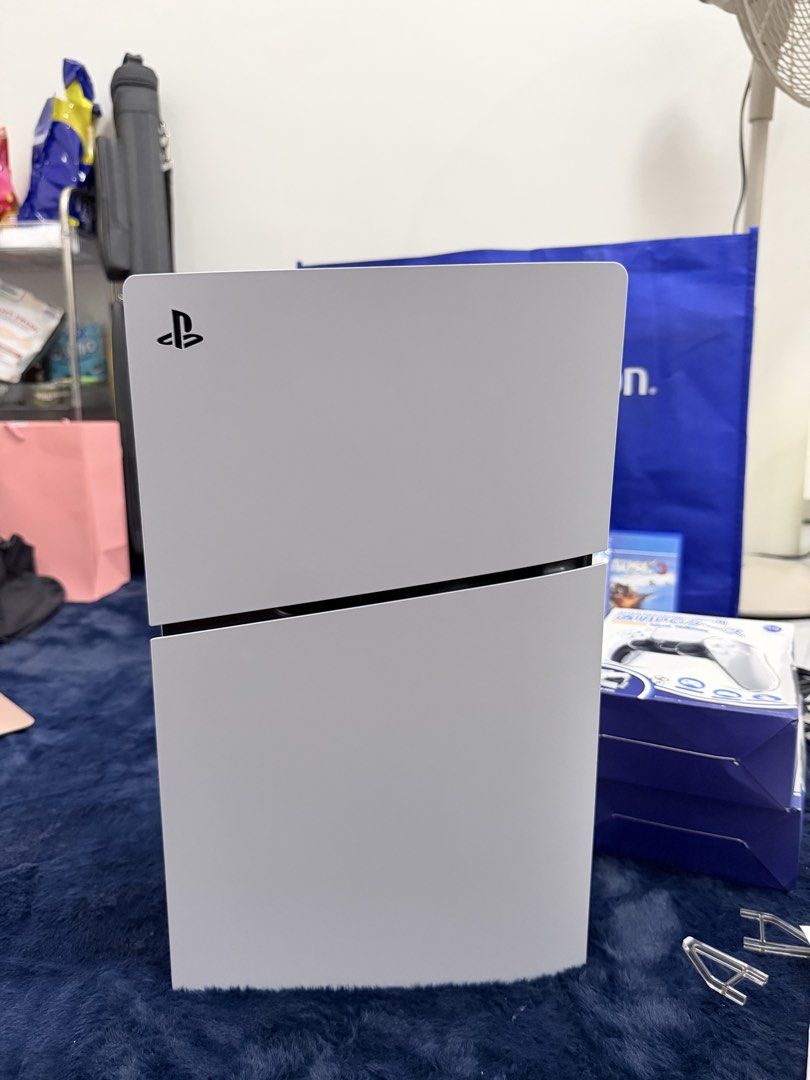 PS5 Slim 1Tb Dual Controller (Category: PlayStation) located in Imus. Submitted by allysadiana (Listing ID 1456088872, Image 2). Description: PS5 Slim 1TB Dual Controller - Almost Brandnew July 11, 2026 - DOP 1x lang nagamit Inclusion: PS5 Slim 1TB Dual Controller - Complete 3 Free Games - Mafia 3 Sealed - Just Cause 3 - Wolfenstein 2 Transparent Controller Case Charging Dock Slighty Nego RFS: Walang Time Laruin /Impulsive buy.