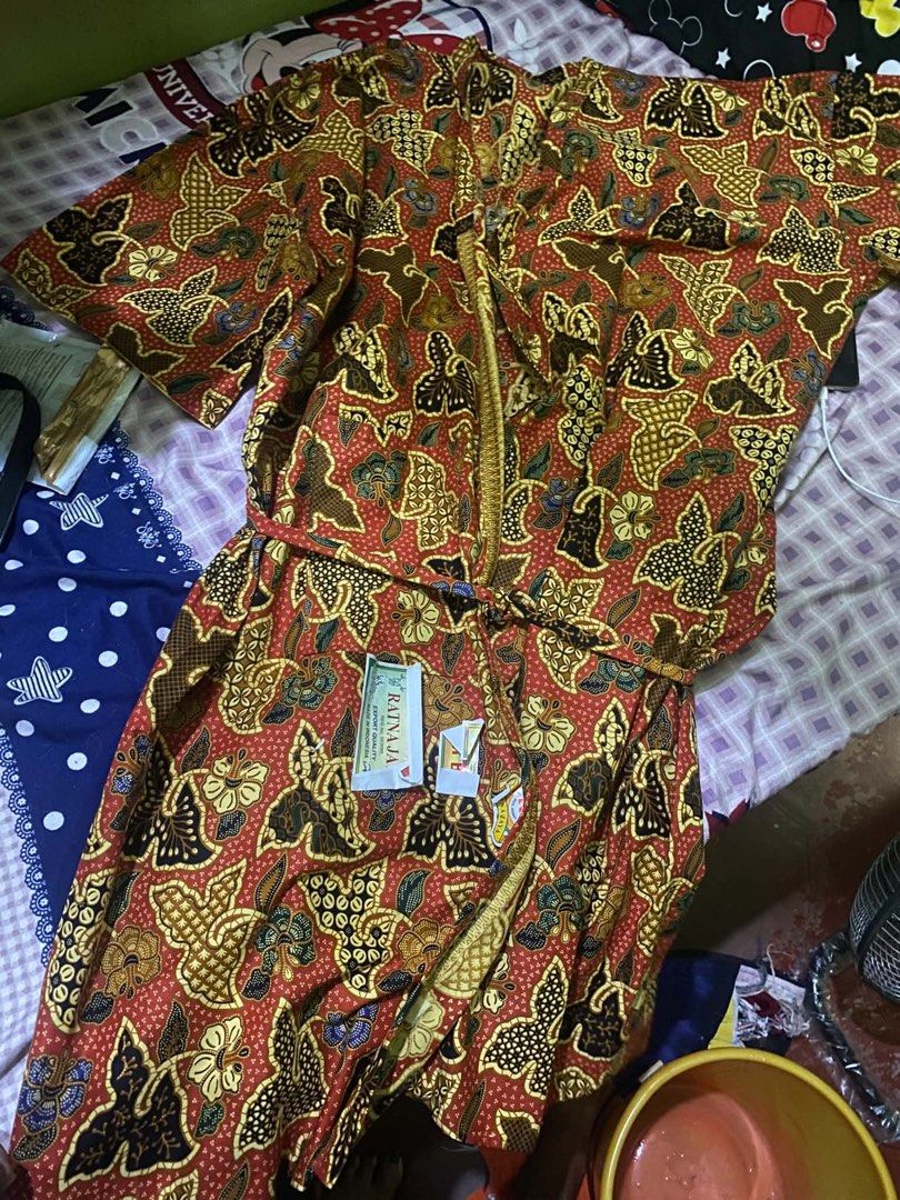 Red Batik Kimono Robe with Belt (Category: Undergarments & Loungewear) located in Caloocan City. Submitted by JennMT (Listing ID 1450361508, Image 2). Description: - Beautiful red kimono robe - Features a traditional batik pattern - Comes with a tie belt to cinch the waist - Made from light and breathable fabric - Versatile: great for lounging or as a stylish cover-up - Unique design, adds a pop of color.