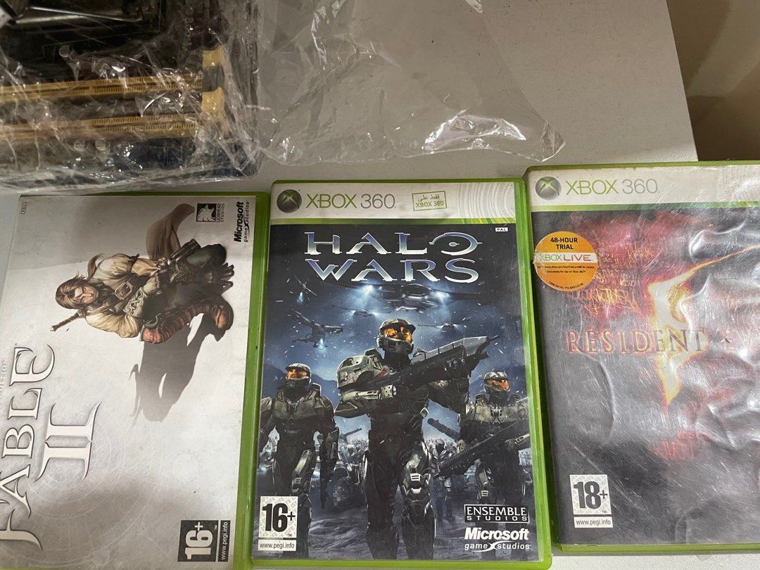 Selling Bundle Xbox 360 Game Discs (Category: Xbox) located in Taguig. Submitted by 30shng (Listing ID 1456106174, Image 1). Description: Selling Xbox 360 Game Discs • Ninja Blade — no cover • Fable II • Resident Evil • Halo Wars All games are untested since I no longer have an Xbox 360 to test them. Discs have no visible cracks or major damage. Sold as-is. Selling as a bundle. PM for price/details..