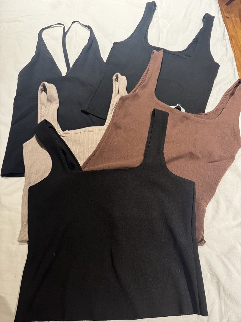 Set of 4 Basic Tank Tops - Black, Brown, Beige (Category: Sleeveless) located in Makati City. Submitted by raremixed (Listing ID 1456058839, Image 1). Description: - Bundle of 4 basic ribbed tank tops and 1 V-Neck halter - Colors: 2 Black, 1 Brown, 1 Beige, 1 Black - Features: Square neckline, stretchy material - Versatile: Great for layering or wearing on its own - Selling all for 500 - Size Large - Comfortable and essential wardrobe pieces.