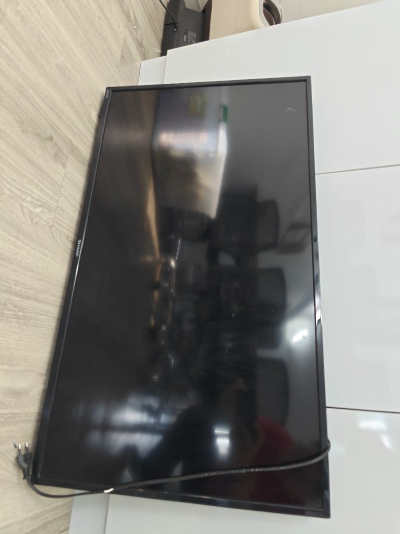 Sharp TV (Category: TV) located in Singapore. Submitted by 97201868 (Listing ID 1456059917, Image 1). Description: - Sharp TV - Black screen with slim bezel - Works well - Includes power cord - Ideal for living room or bedroom.
