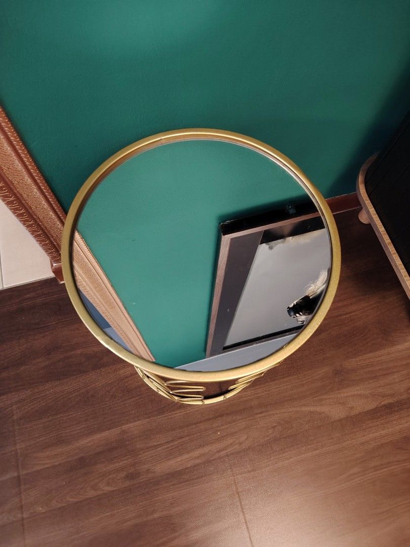 SIDE TABLE (Category: Tables & Sets) located in Kuala Lumpur. Submitted by khai.taufan (Listing ID 1456069377, Image 3). Description: - Elegant round side table - Features a striking gold metal geometric base - Mirror glass top - Ideal accent piece for living rooms, bedrooms, or entryways - Perfect for holding plants, drinks, or decorative items - Lightweight and easy to reposition - Dimensions: Approximately 18 inches tall and 12 inches diameter